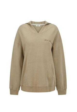 a-beige-pullover-hoodie-with-a-v-neck-kangaroo-pocket-and-subtle-script-embroidery-on-the-left-chest-displayed-against-a-plain-white-background