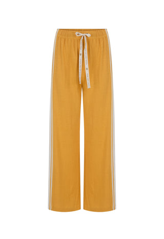  mustard yellow track pants with white side stripes