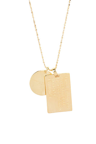 close-up-back-view-of-spell-s-leo-stargazer-zodiac-necklace-charms-one-charm-is-of-a-rectangular-shape-and-an-inspirational-quote-while-the-other-charm-is-circular-the-brand-name
